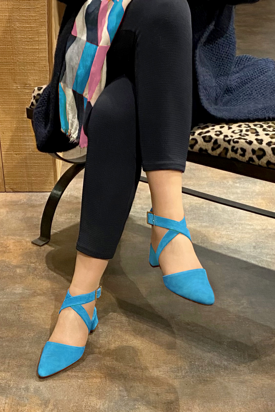 Turquoise blue women's open back shoes, with crossed straps. Tapered toe. Low flare heels. Worn view - Florence KOOIJMAN
